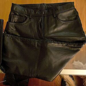 Custom black leather fully lined, leather cross stitching down the side. 29”